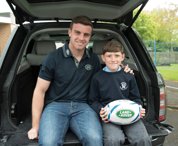 Land Rover ambassador George Ford with one of the lucky mascots for Rugby World Cup 2015